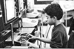 student typing on keyboard